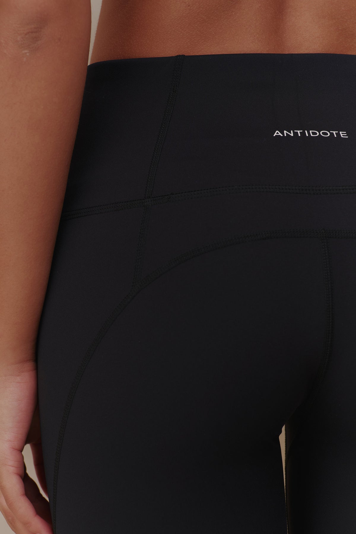 Opaque fabric and waistband logo on the Essential Leggings