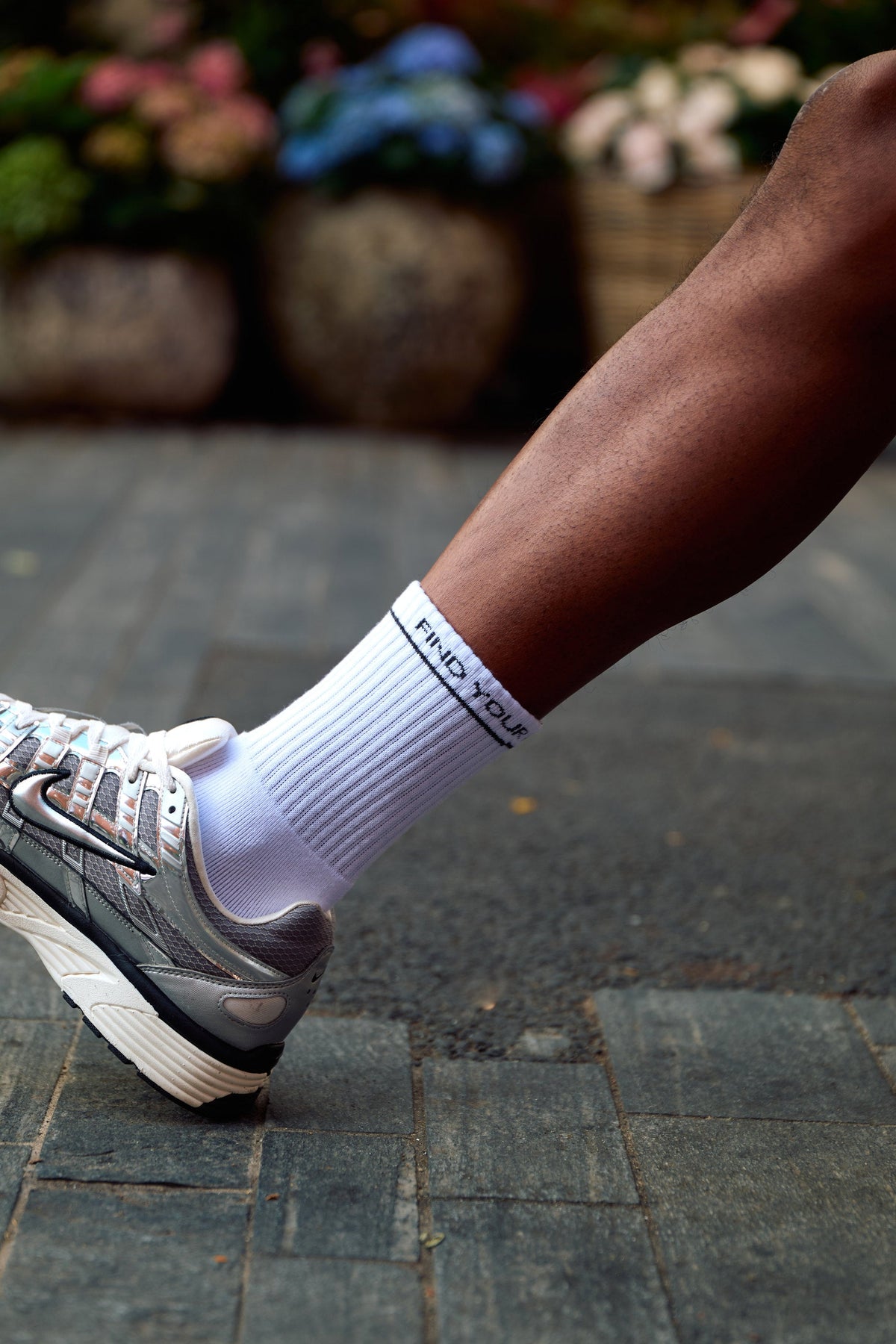 Close-up of the find your antidote Essential Socks in White