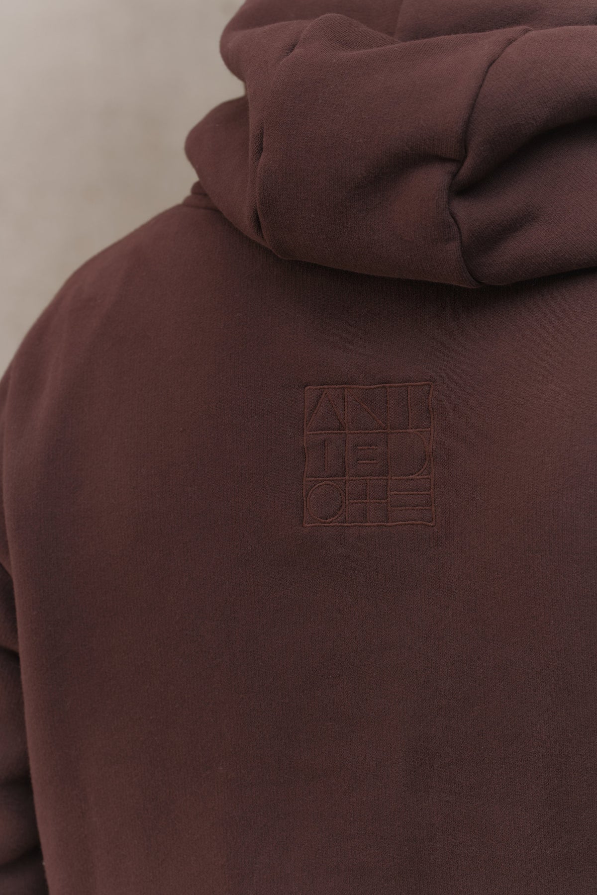 Tonal embossed logo on the back of the Recovery Hoodie