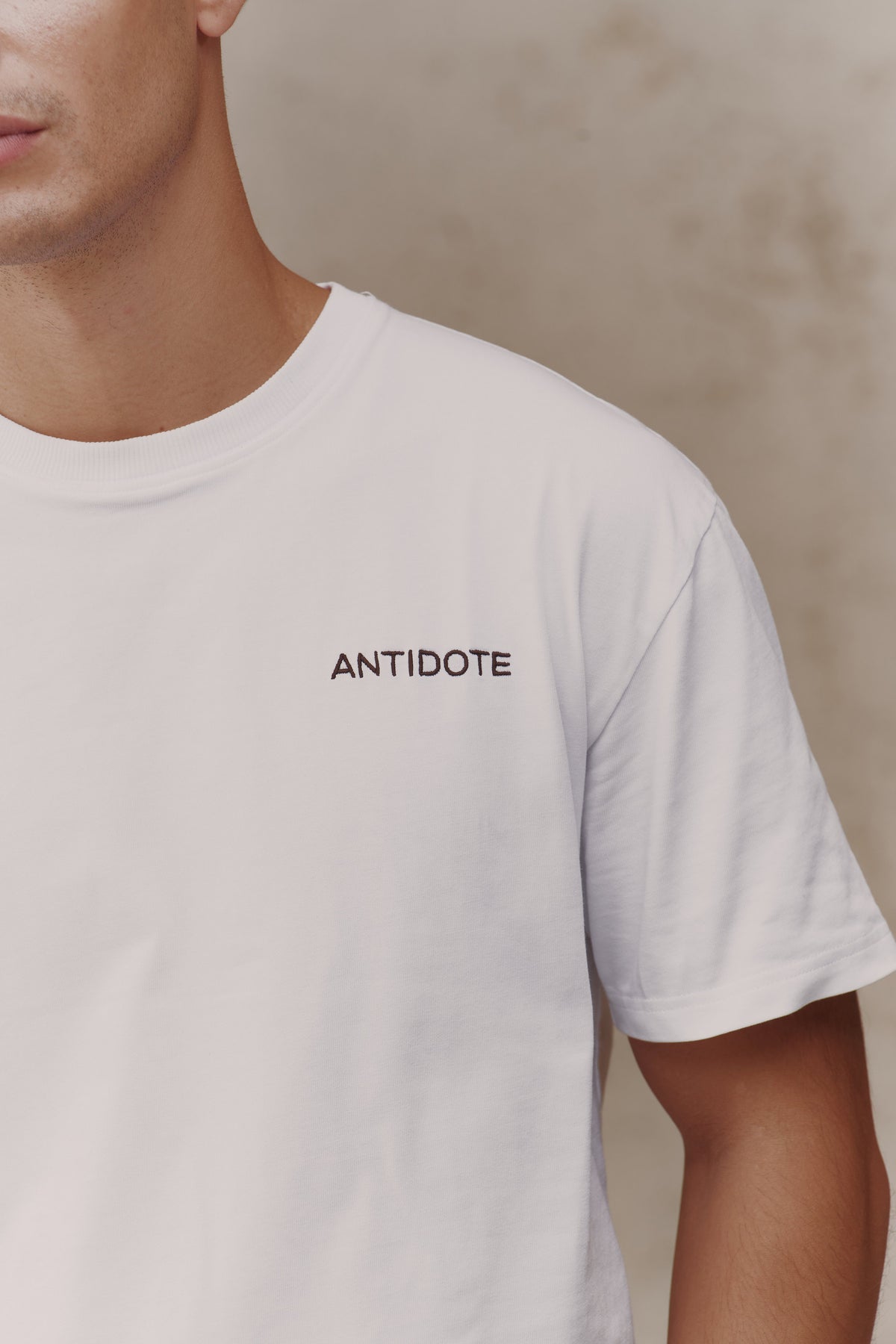 Ribbed neckline and chest embroidery on the Reset Tee
