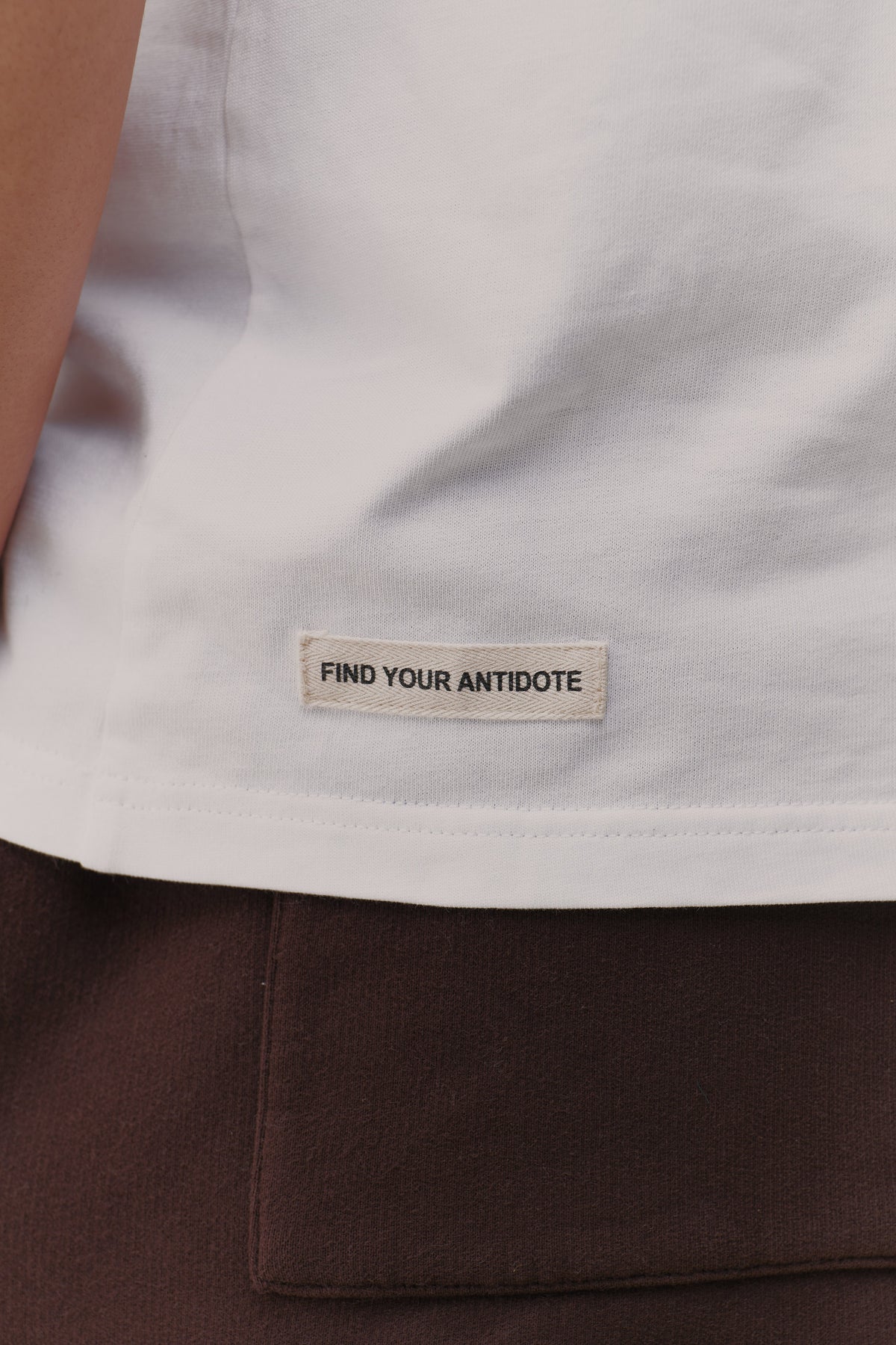 find your antidote patch on the hem of the Reset Tee