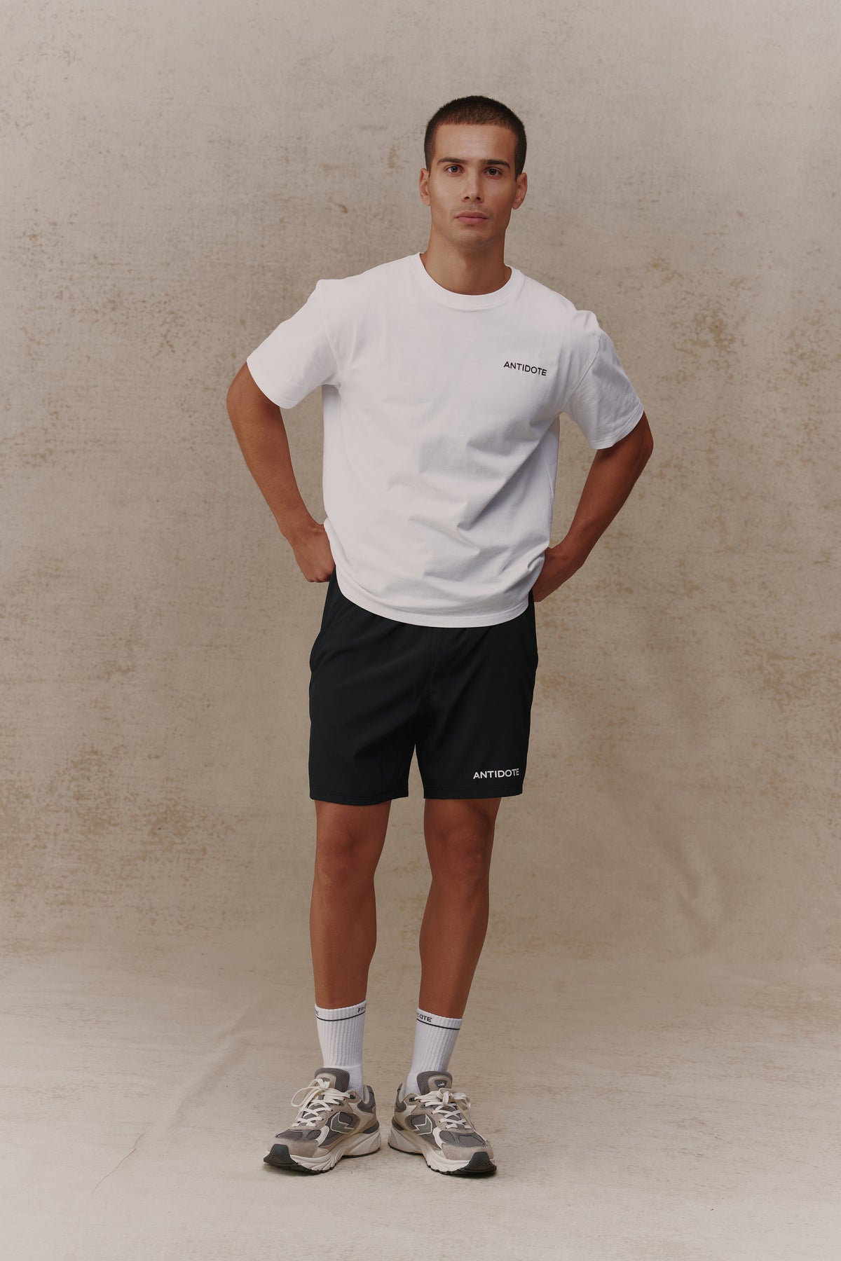 Man wearing the Antidote Reset Tee in Crisp White, front view