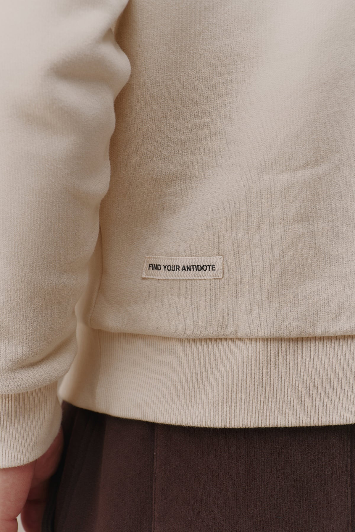 find your antidote patch on the hem of the Revive Sweatshirt