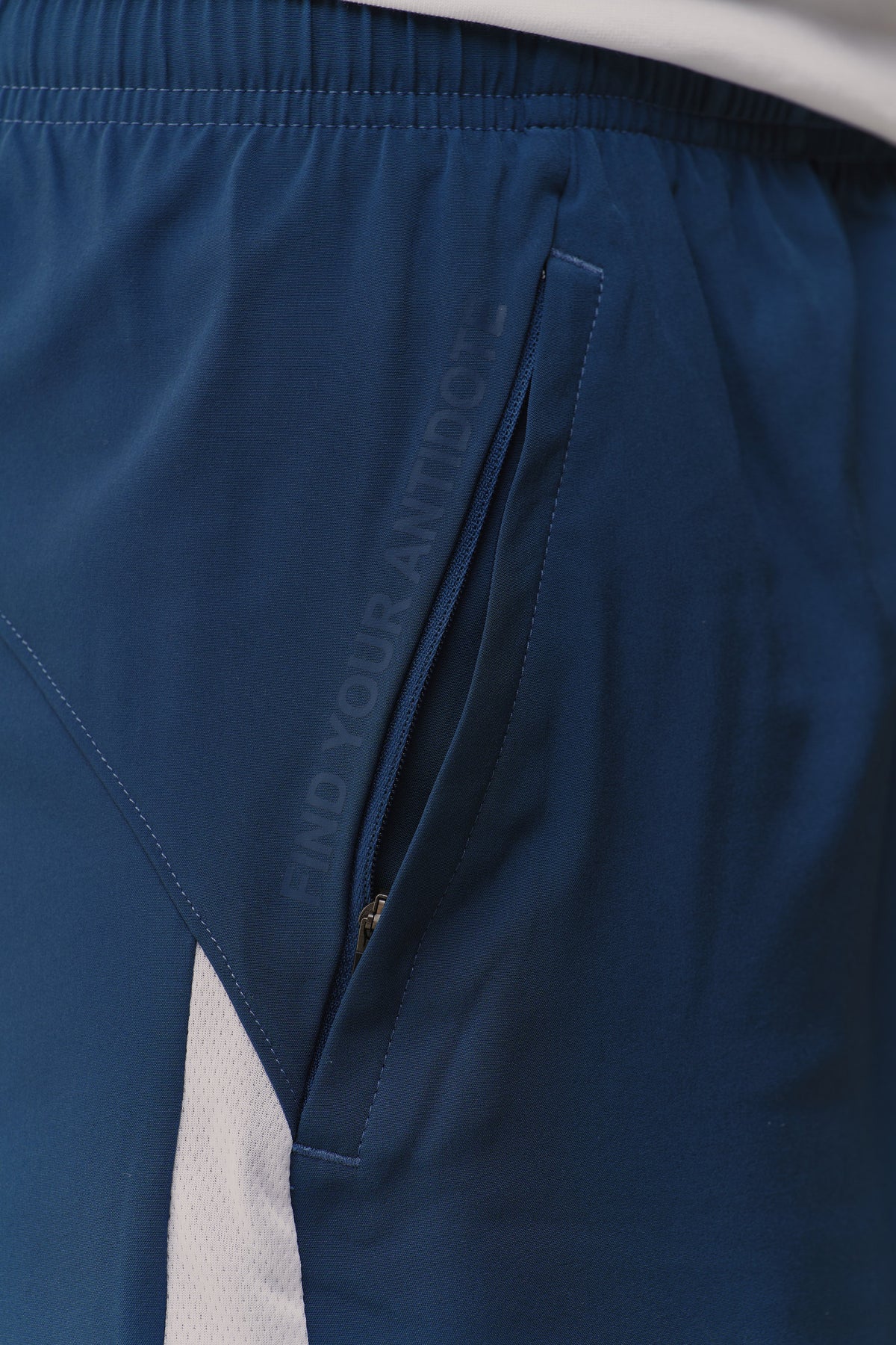 Tonal find your antidote print beside the zip pocket