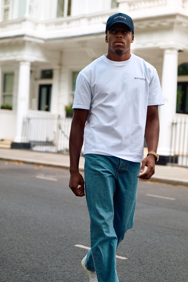 Man wearing the Antidote Reset Tee in Crisp White