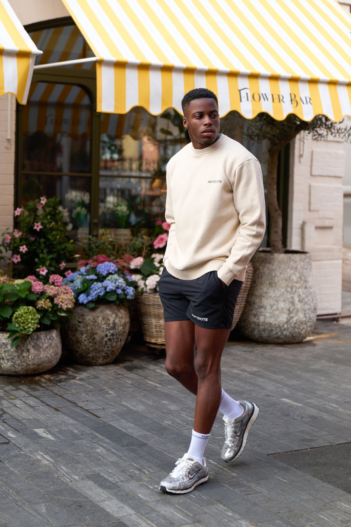 Man wearing the Antidote Revive Sweatshirt in Sand