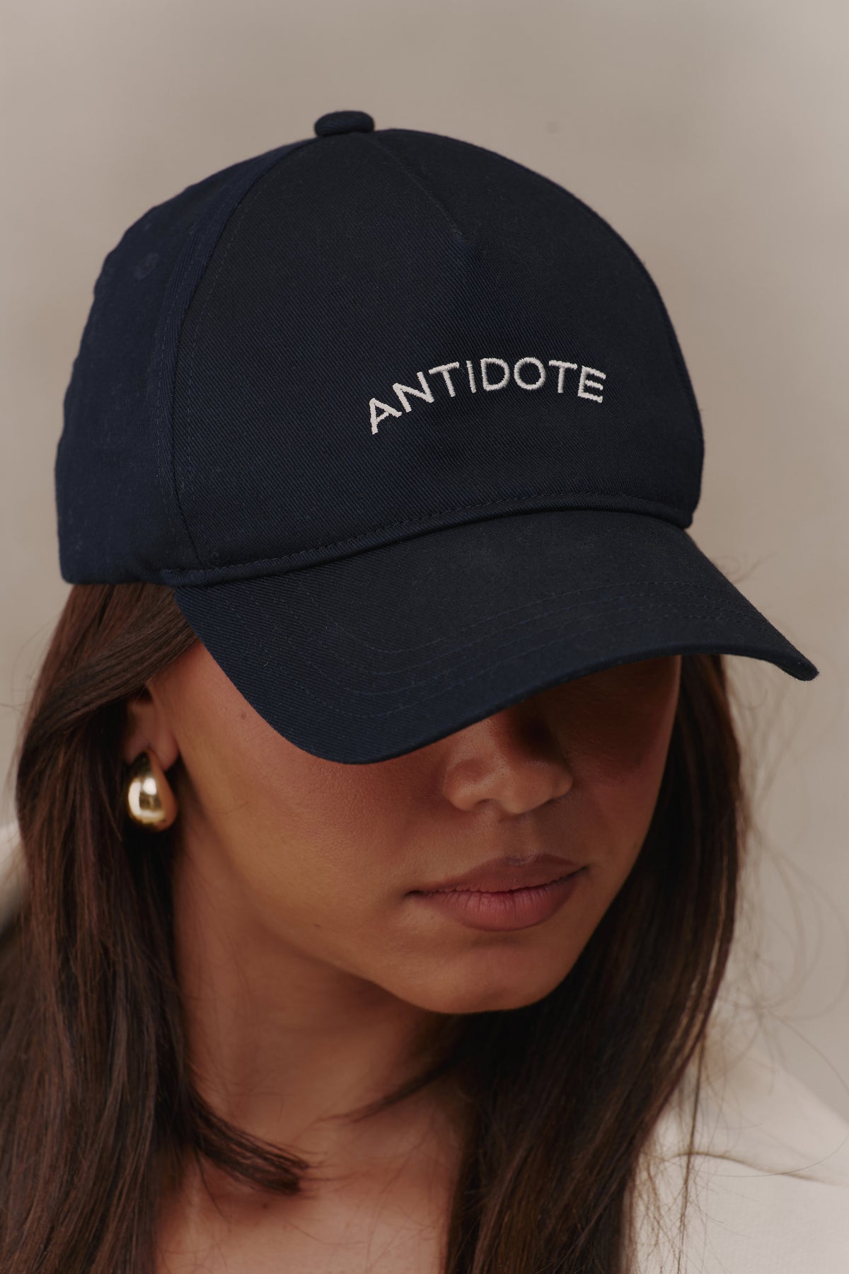 Close-up of the Antidote embroidery on The Original Antidote Cap