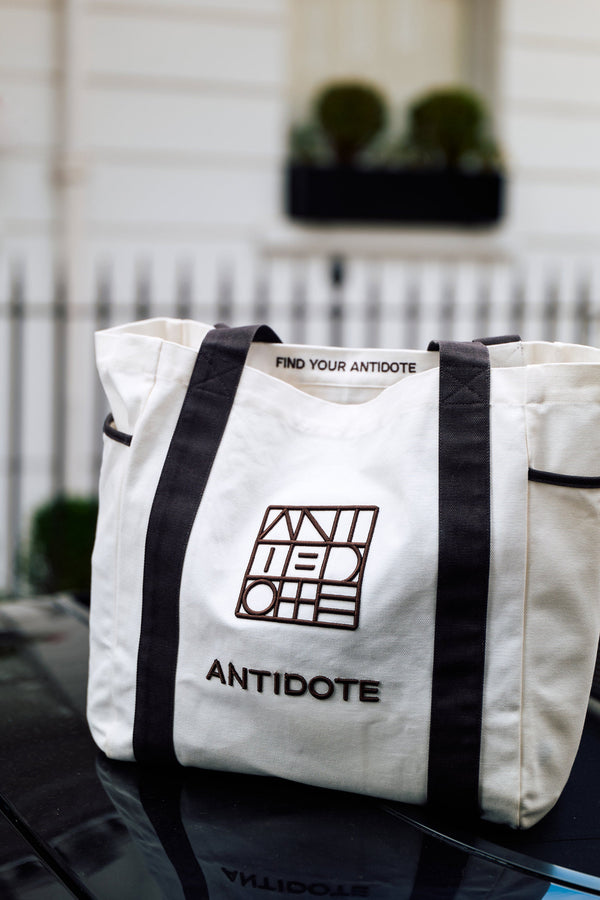 The Antidote Two Tone Tote in Charcoal on a car bonnet