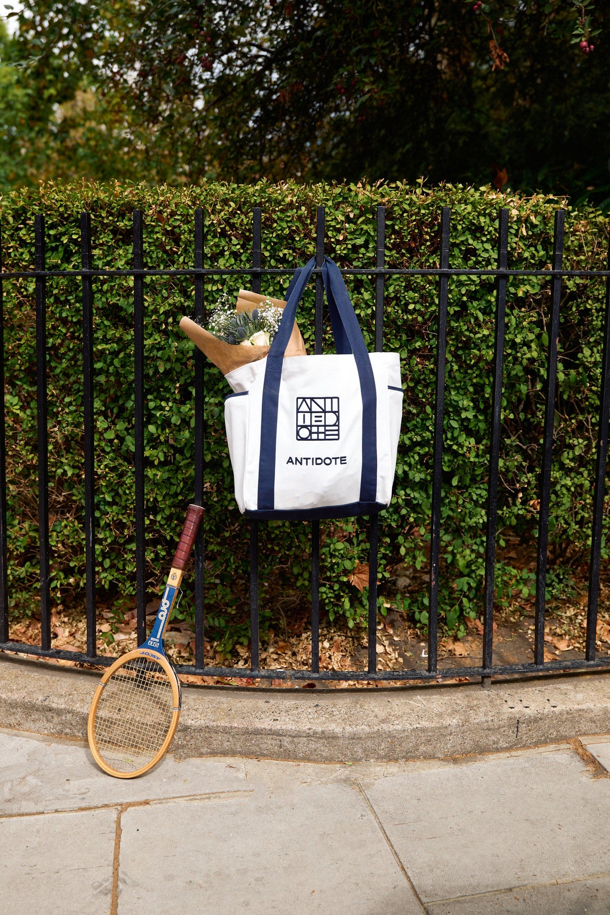 The Antidote Two Tone Tote in Ocean Blue with a tennis racket