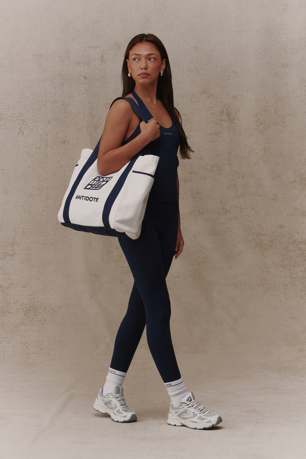 Woman carrying the Antidote Two Tone Tote in Ocean Blue