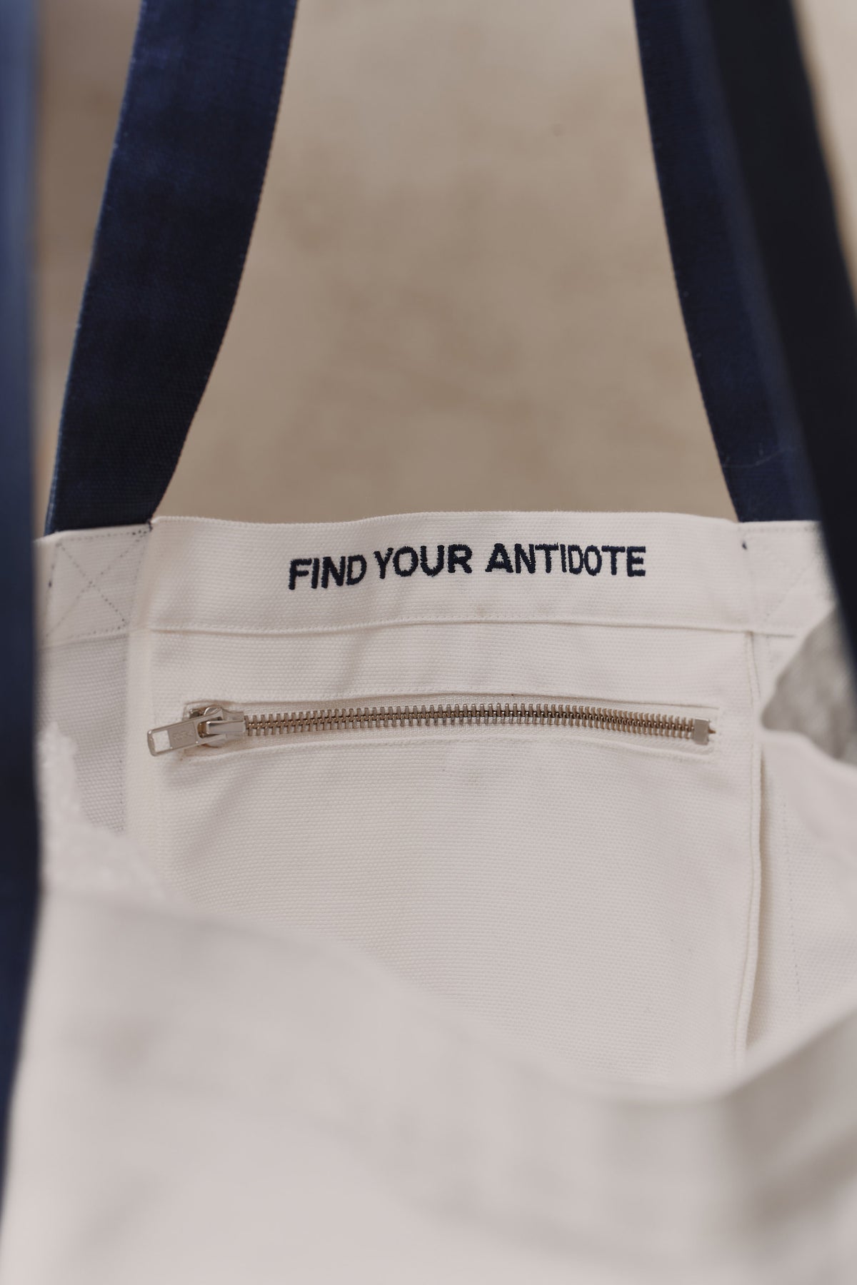 Internal zip pocket of the Antidote Two Tone Tote in Ocean Blue