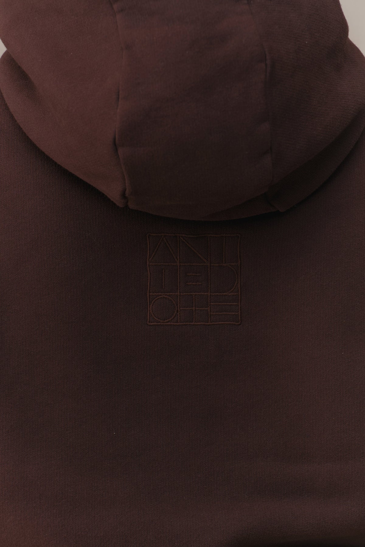 The deep hood and embossed back logo on the Recovery Hoodie