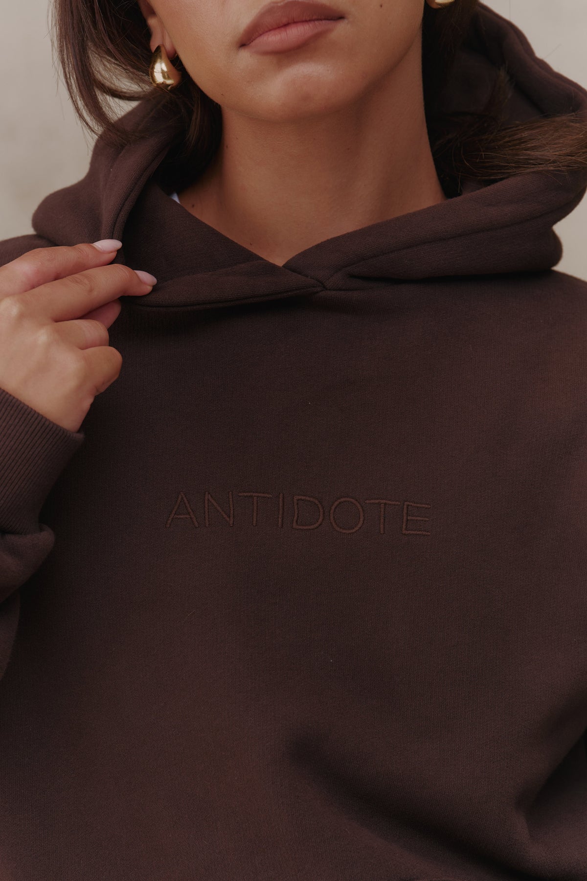 Tonal Antidote embroidery on the front of the Recovery Hoodie
