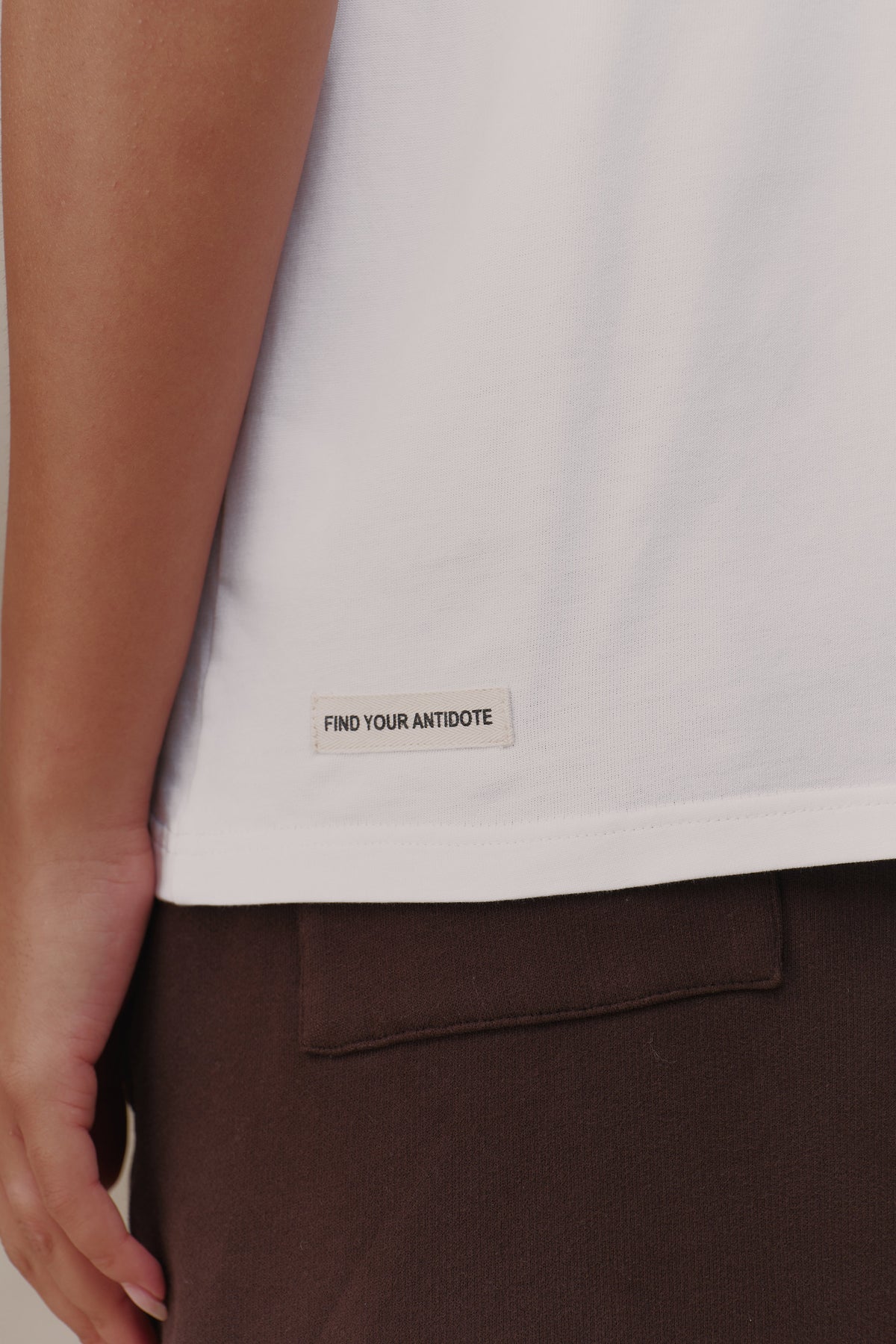 find your antidote patch on the hem of the Reset Tee
