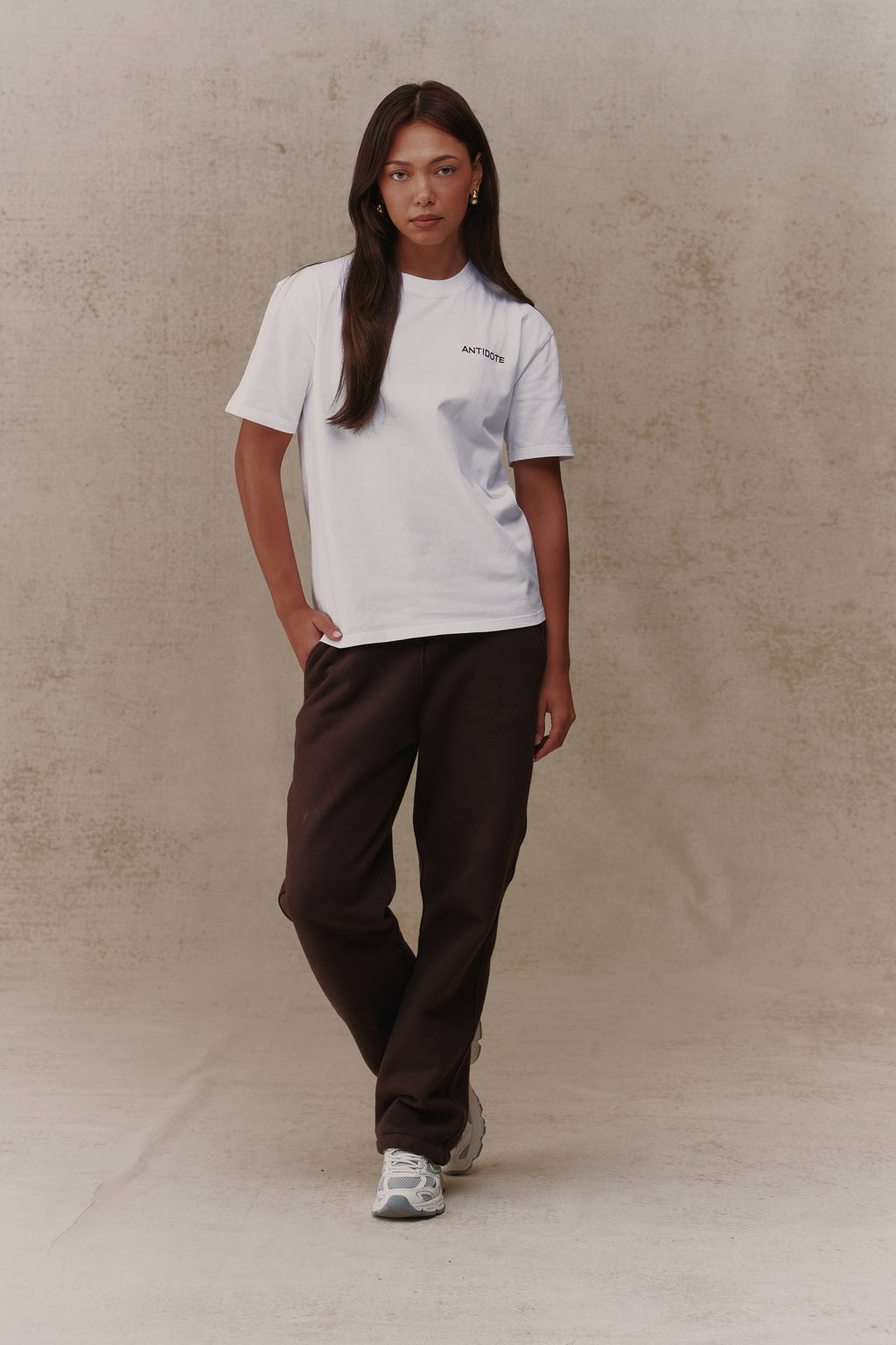 Woman wearing the Antidote Reset Tee in Crisp White, front view