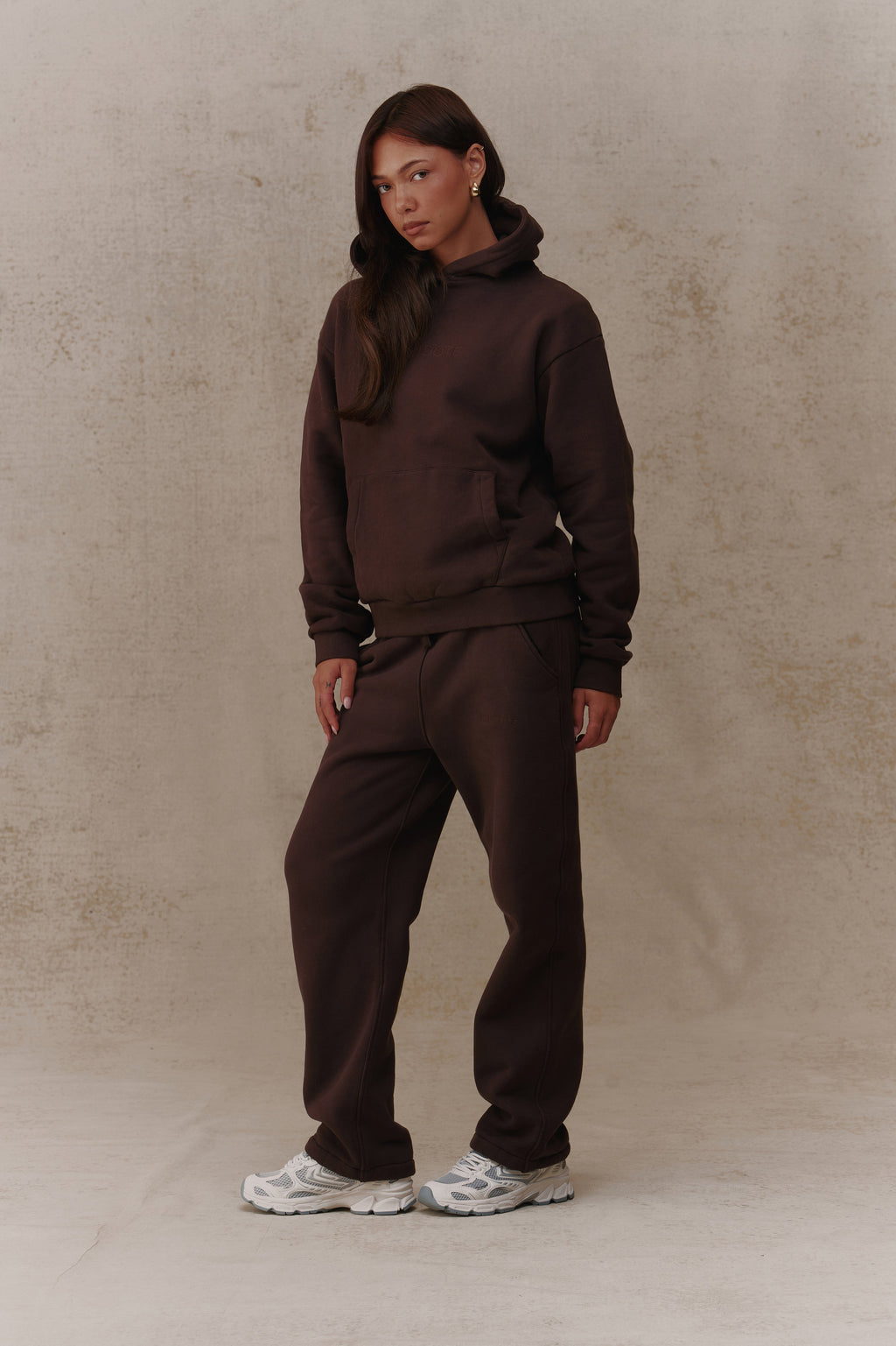 Woman wearing the Antidote Women's Restore Joggers in Ganache, front view