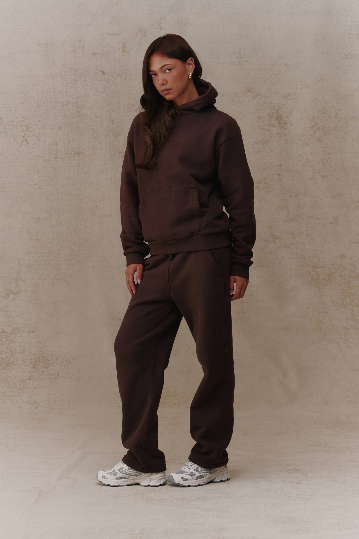 Woman wearing the Antidote Women's Restore Joggers in Ganache, front view