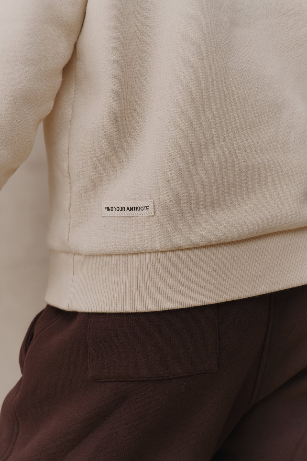 find your antidote patch on the hem of the Revive Sweatshirt