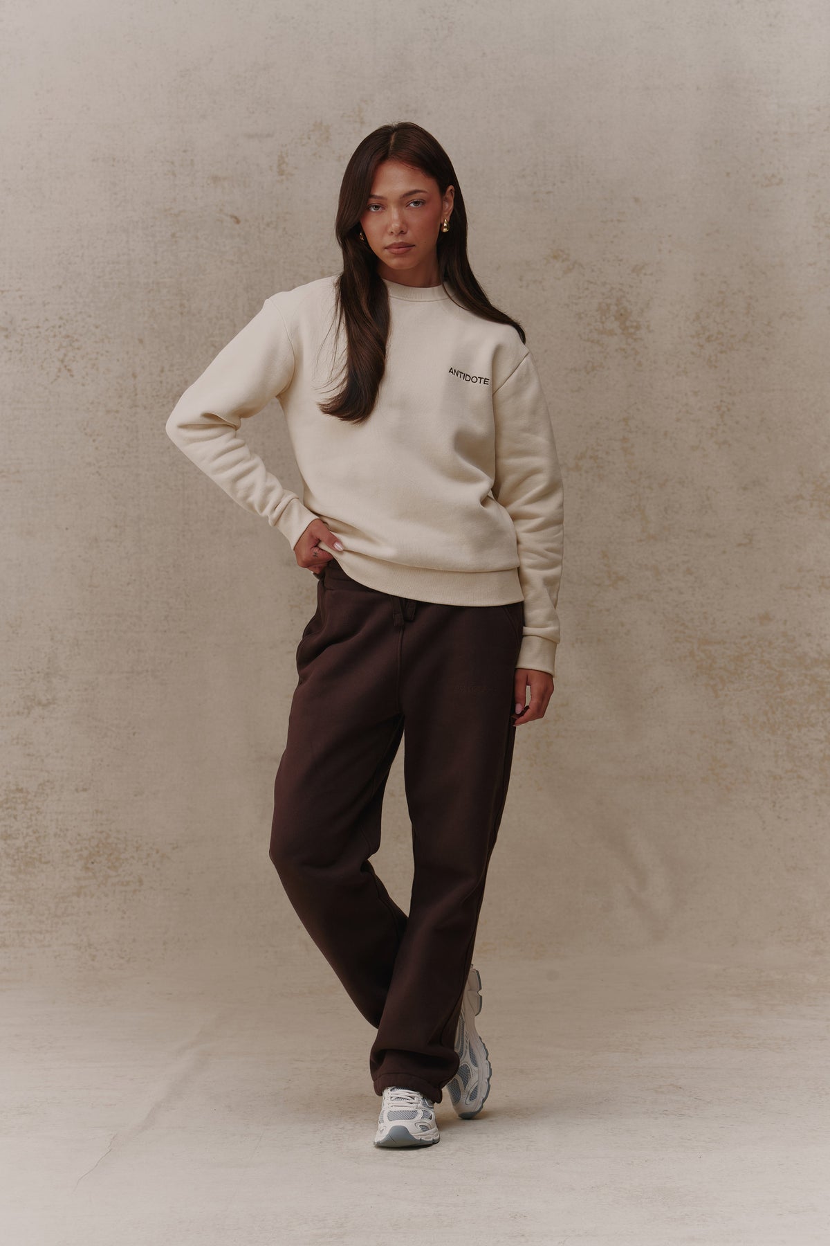 Woman wearing the Antidote Revive Sweatshirt in Sand, front view